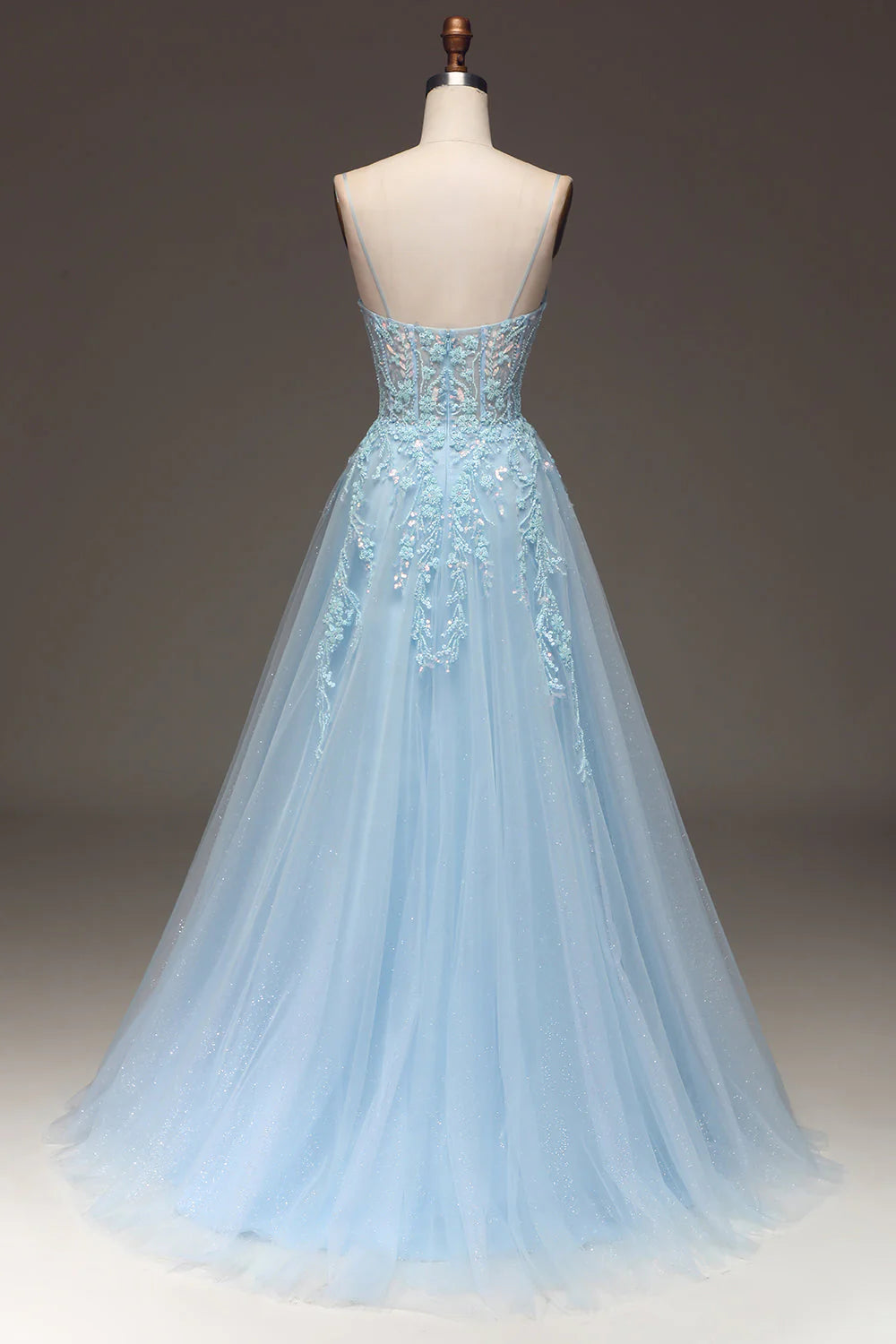Back view of a light blue A-line sequin prom dress with spaghetti straps.