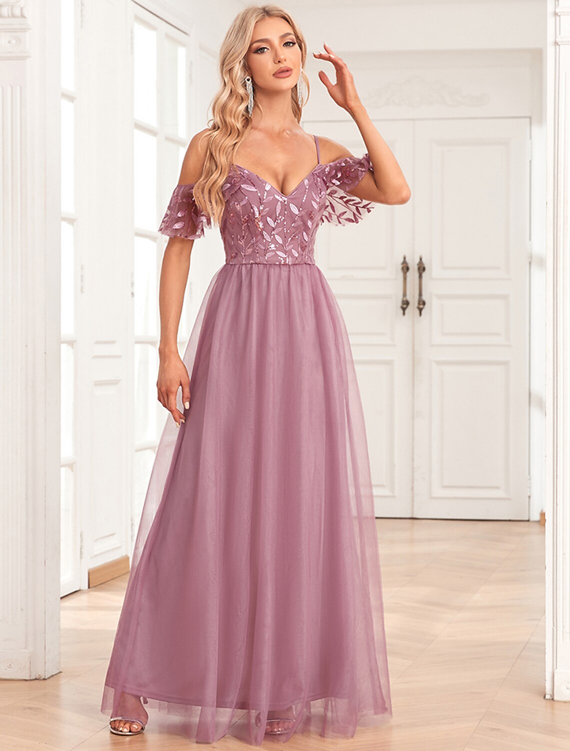 Back view of the A-line evening gown, showcasing the V-back and sequin details.