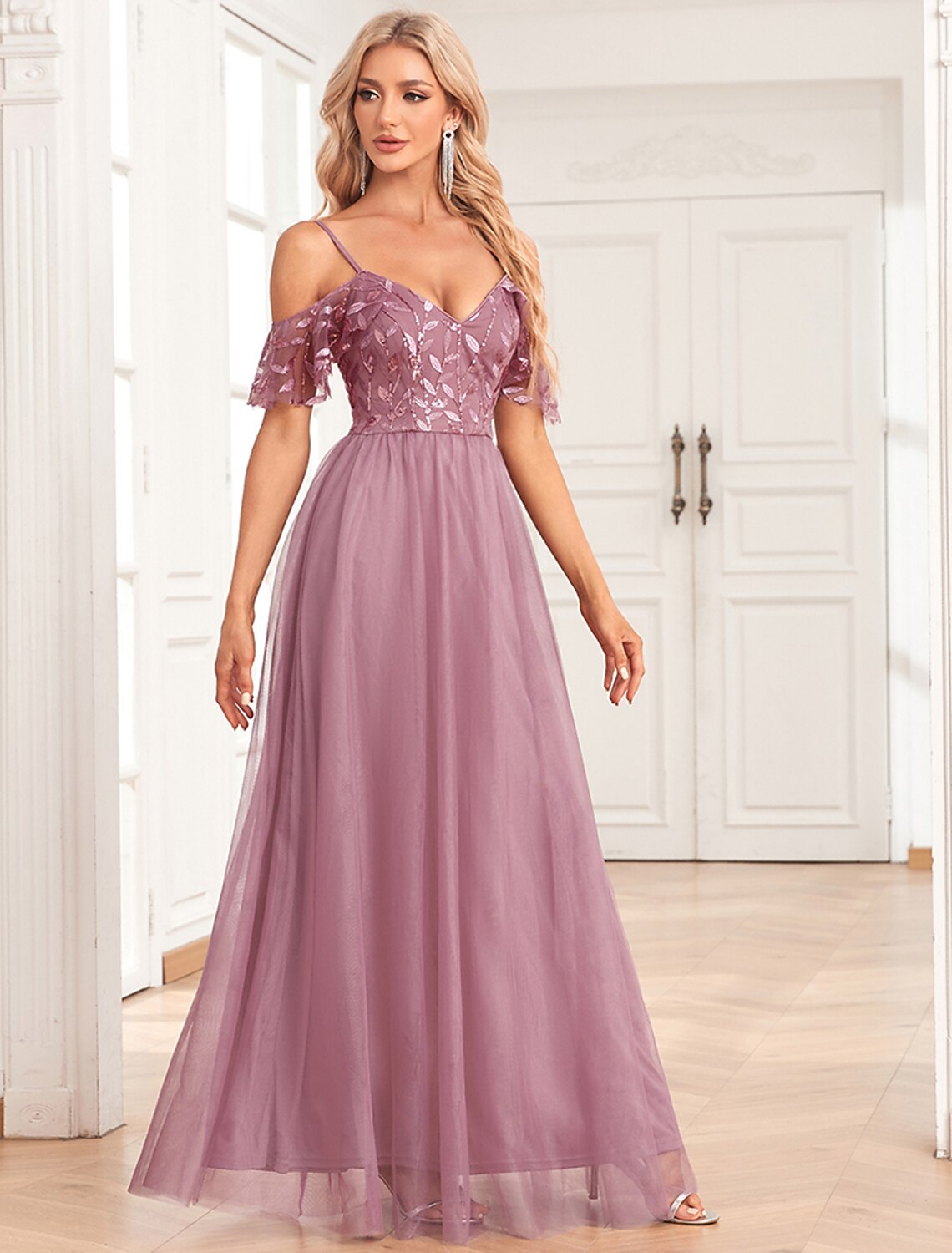 Close-up of the sequin embroidery and tulle fabric on the elegant evening dress.