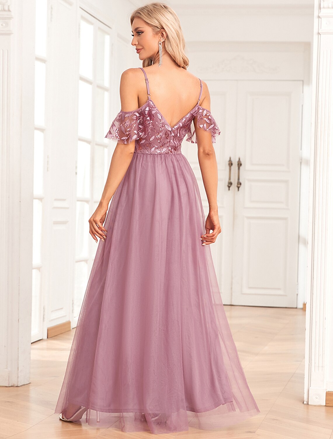 Full length view of the woman in the shimmering A-line evening gown.