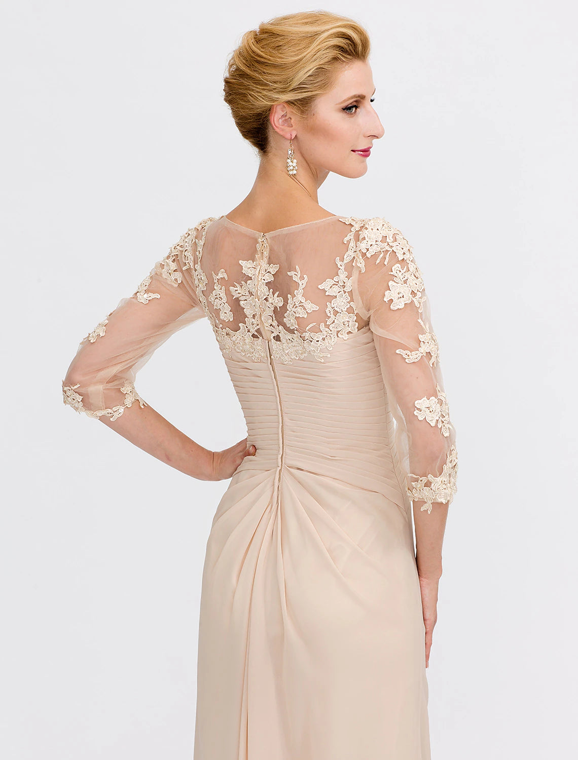 Detail of the elegant appliques on the chiffon dress.