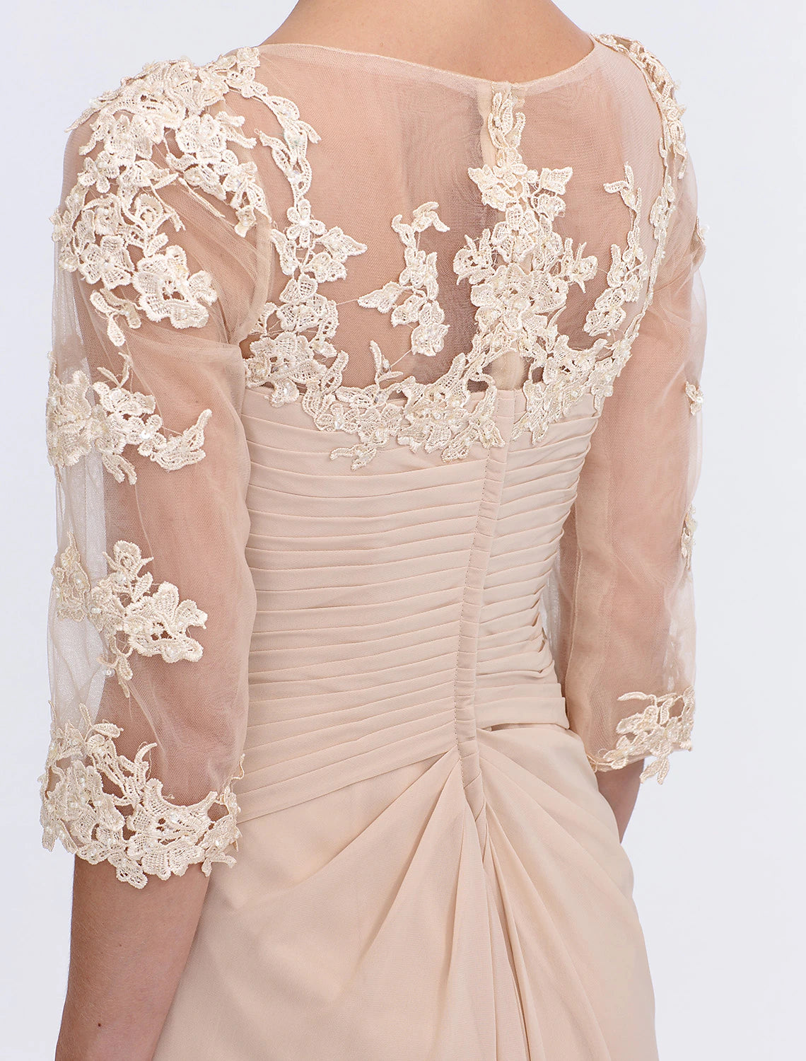 Flowing chiffon skirt and side draping of the A-line gown.