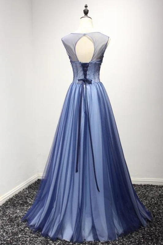 Back view of a long A-Line tulle prom dress with rhinestone embellishments.