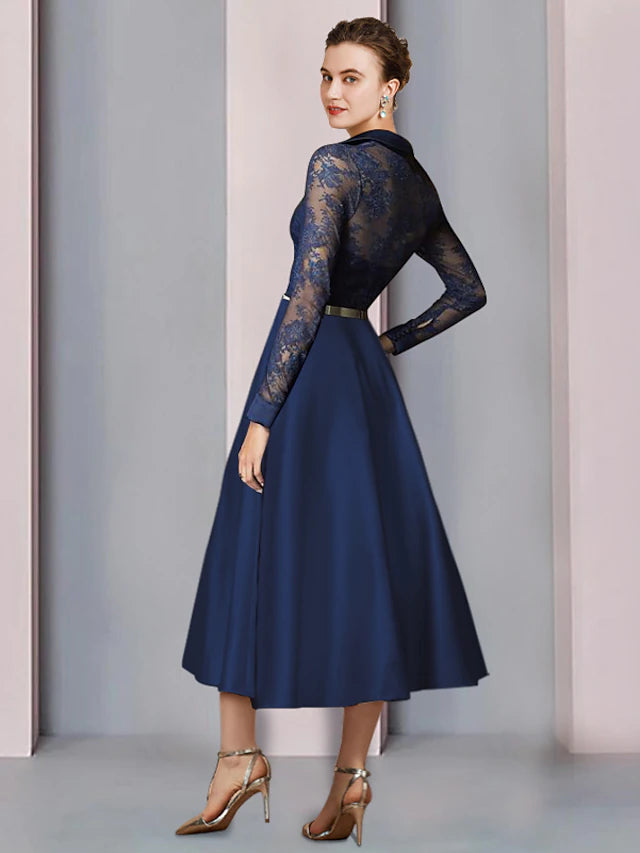 Back view of the elegant A-line tea-length dress with long sleeves and pleated skirt.