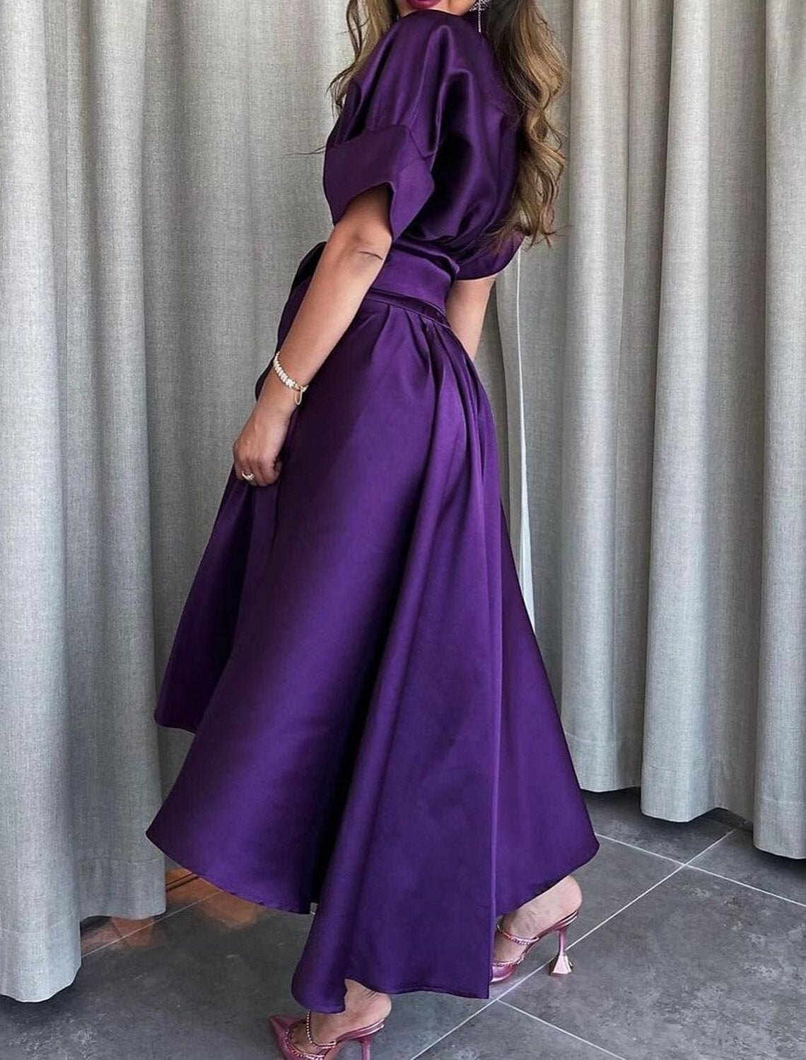 Back view of the formal A-line satin dress.