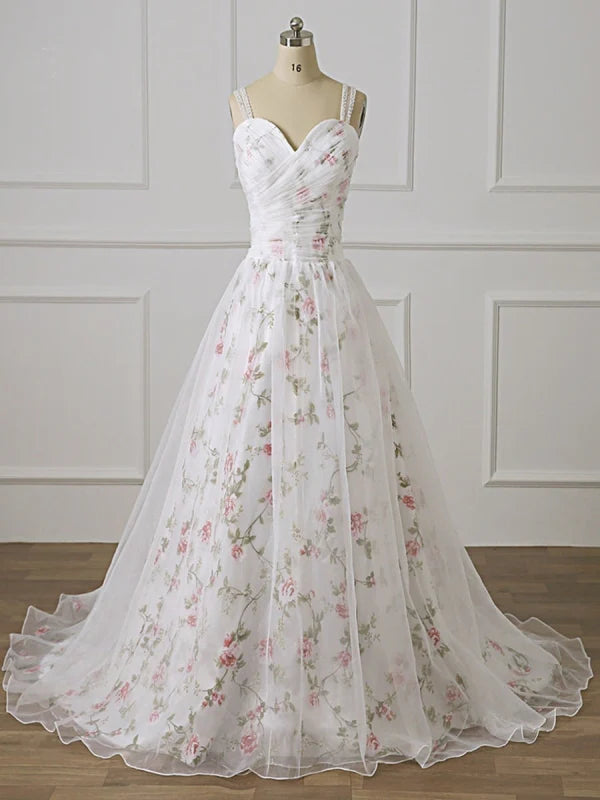 Elegant long prom dress with intricate appliques and lace detailing.