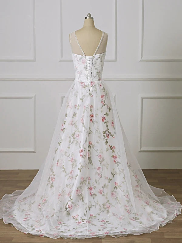 Close-up of the lace and applique details on a long formal gown.