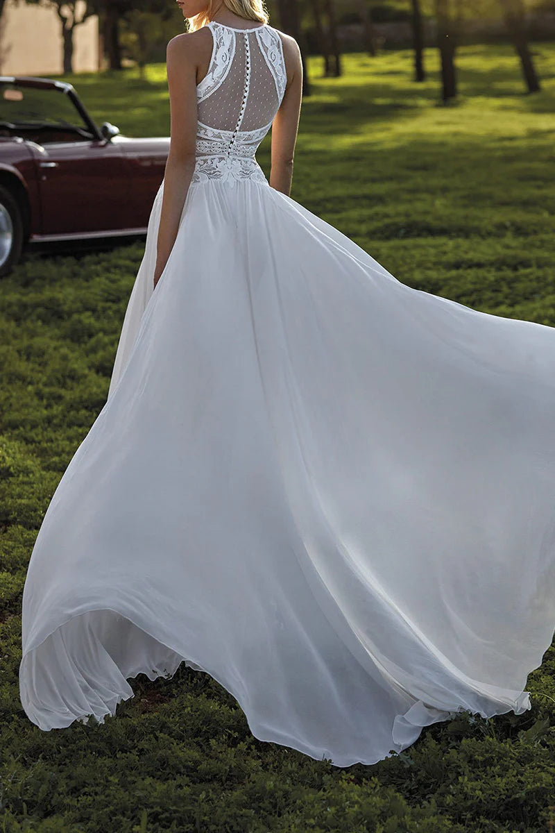 Back view of a sleeveless A-Line wedding dress with lace details.