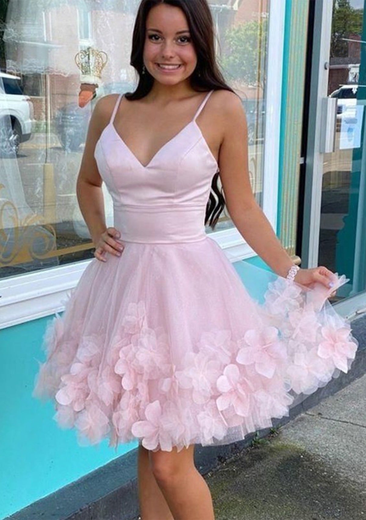 Blush pink A-line homecoming dress with spaghetti straps and 3D floral tulle skirt.