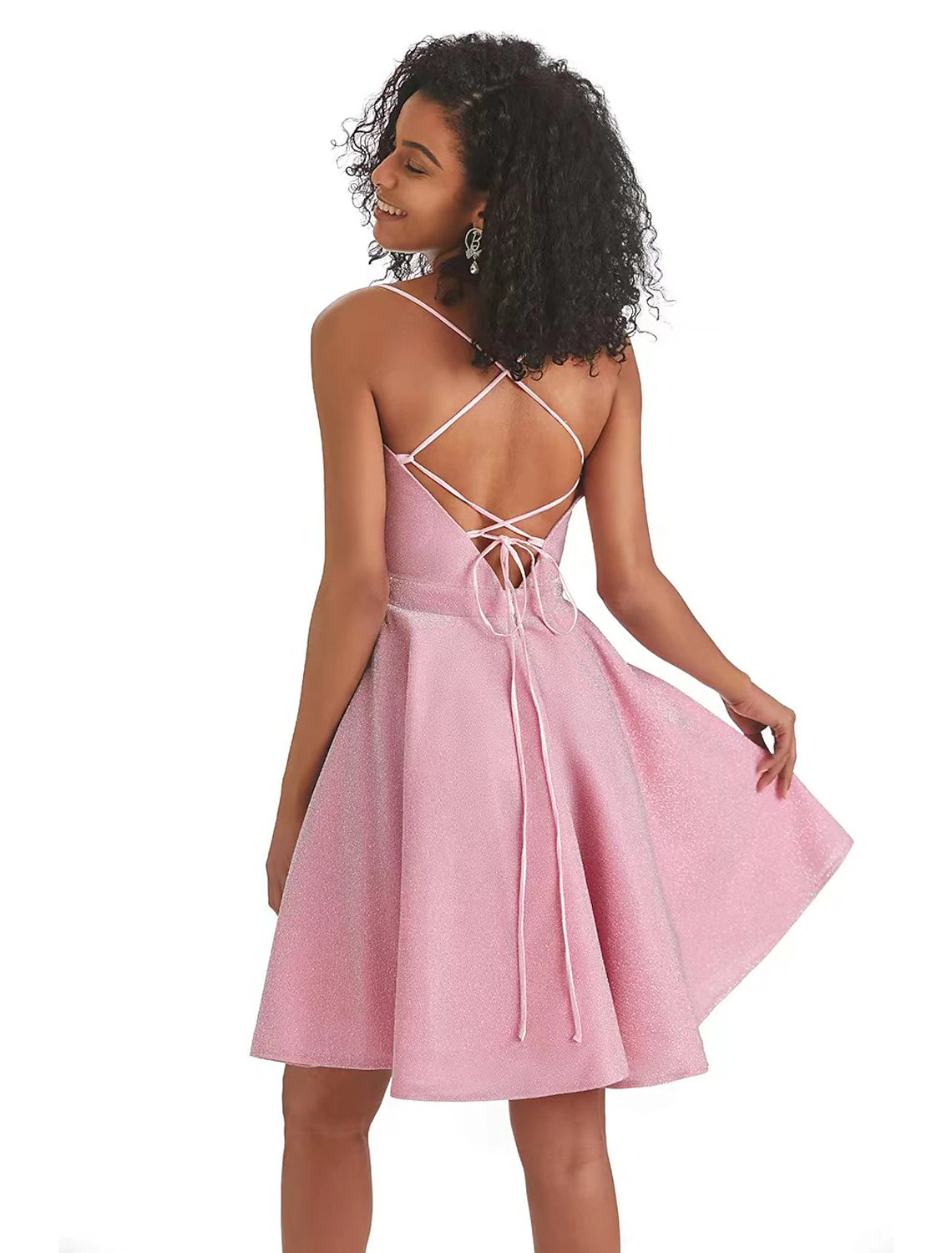 Close-up of sequin and lurex fabric on pink A-line dress.
