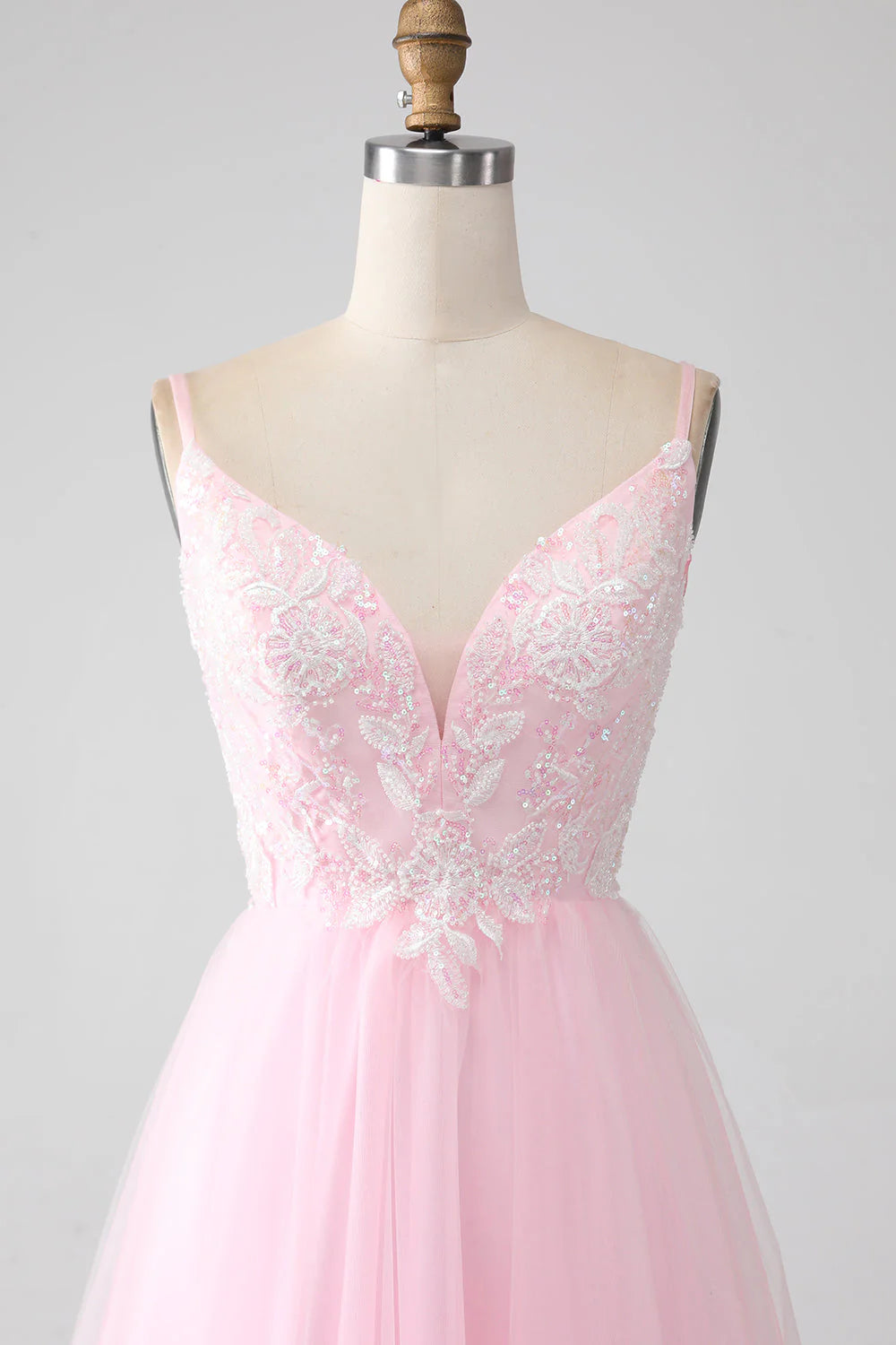 Close-up of beading detail on light pink A-line dress.