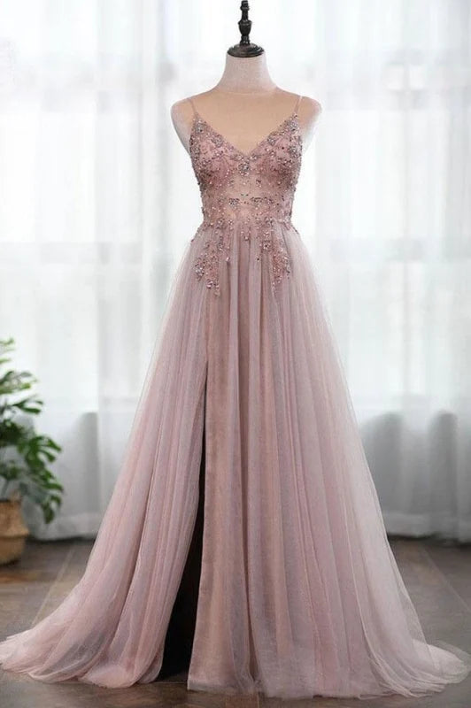 Elegant A-line prom dress with spaghetti straps and beaded bodice.