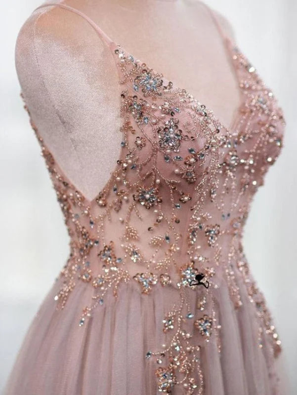 Beaded bodice and spaghetti straps of a formal A-line dress.
