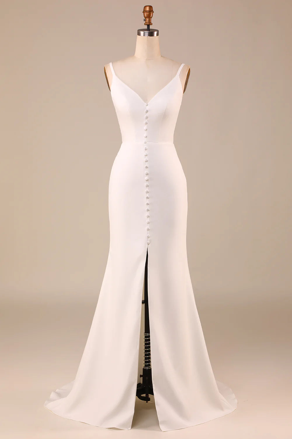 Elegant ivory A-line wedding dress with spaghetti straps and button back.