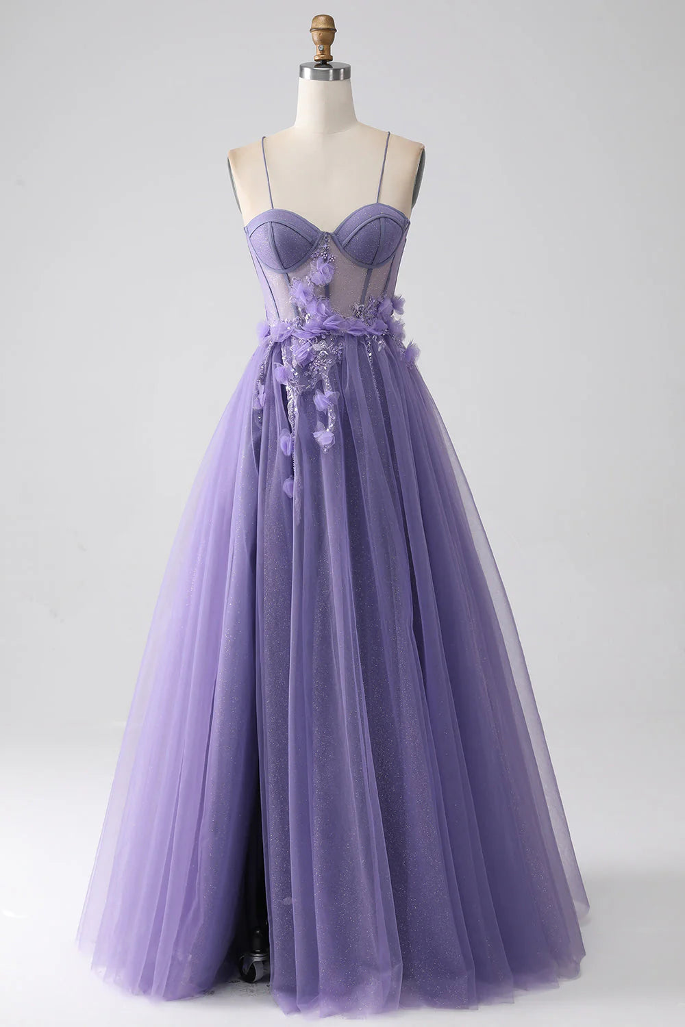 Purple A-line prom dress with spaghetti straps and 3D floral details.