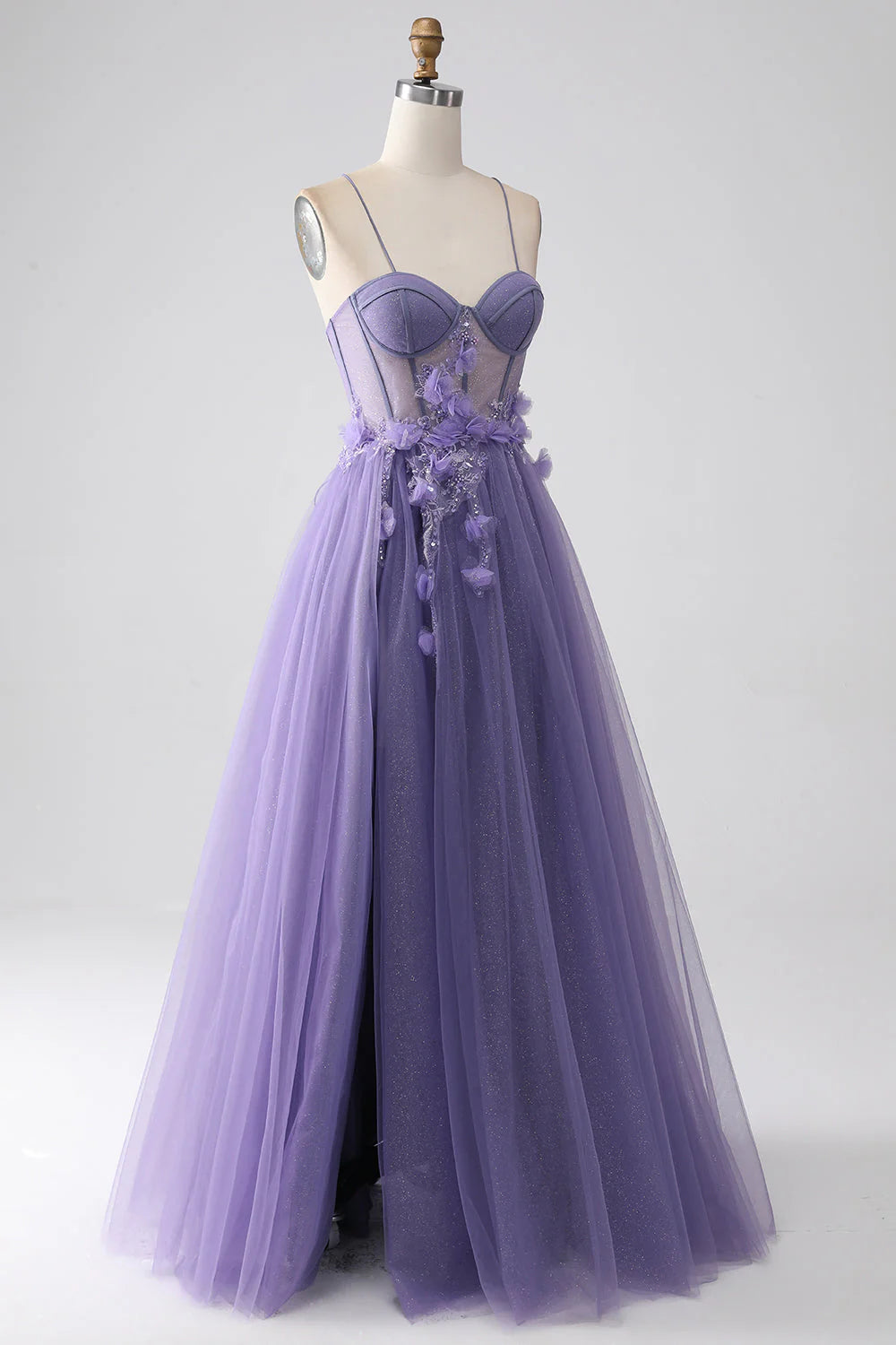 Side view of an elegant purple A-line prom gown with spaghetti straps.