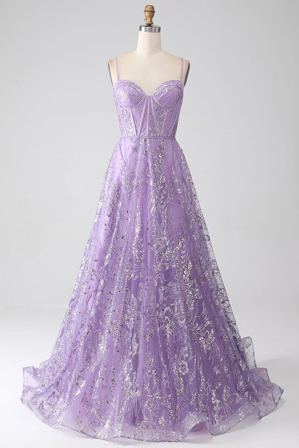 Lilac A-line prom dress with spaghetti straps, corset bodice, and sequin embellishments.