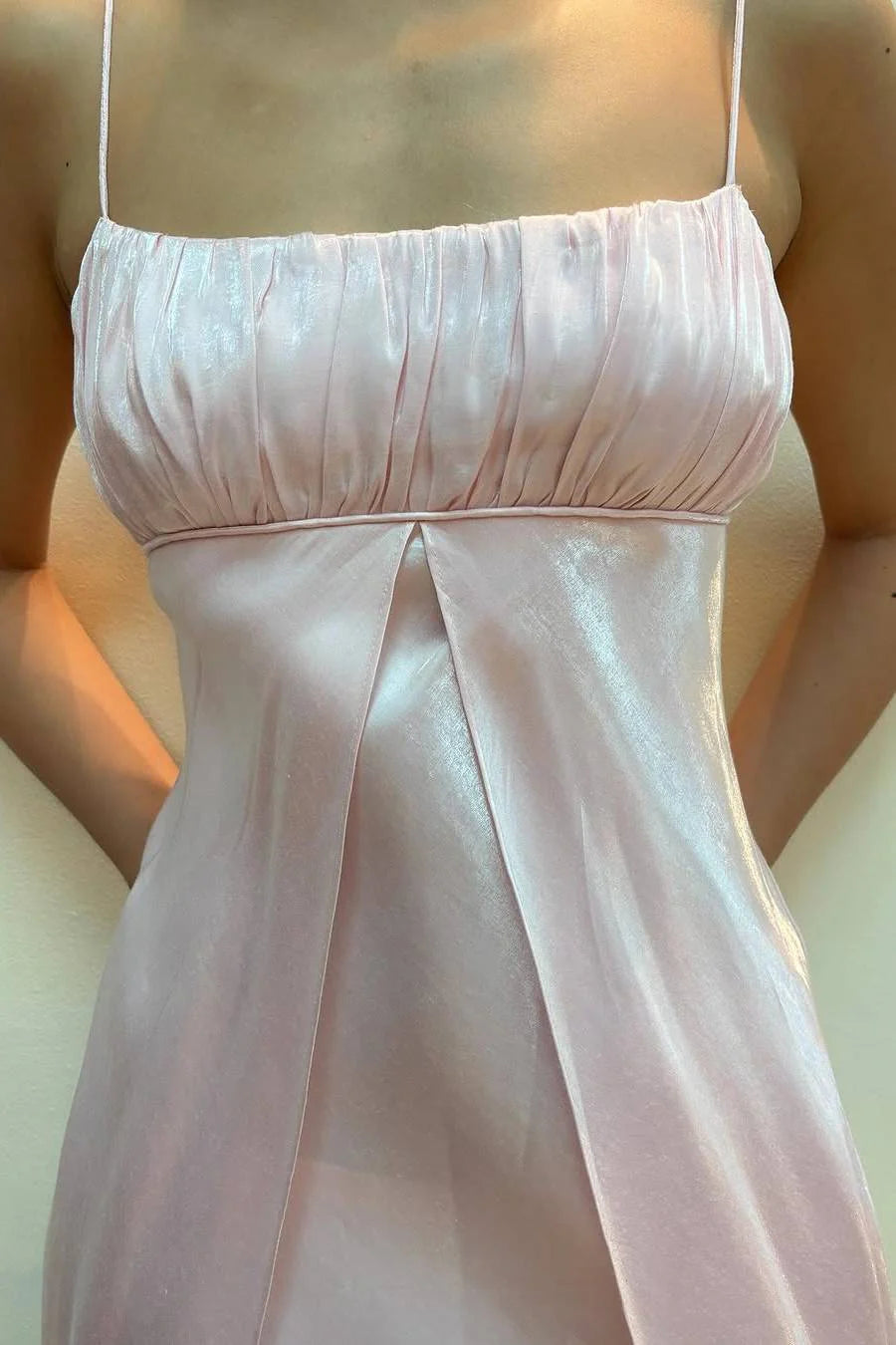 Back view of the sleeveless pink A-line formal gown.