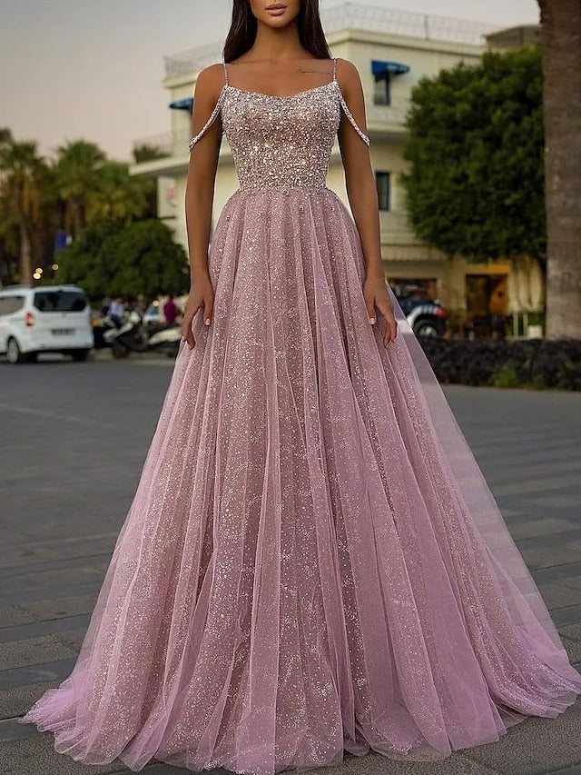 A-line prom dress with spaghetti straps and floor-length skirt.
