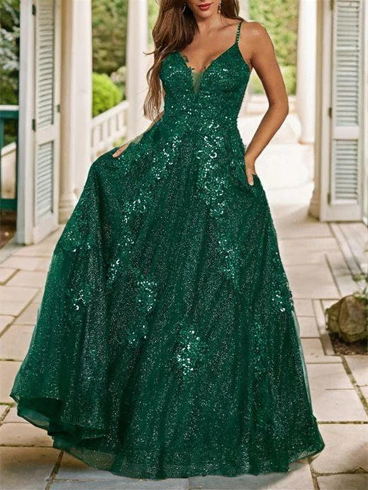 Back view of the A-line spaghetti strap dress, highlighting the delicate straps and long skirt.