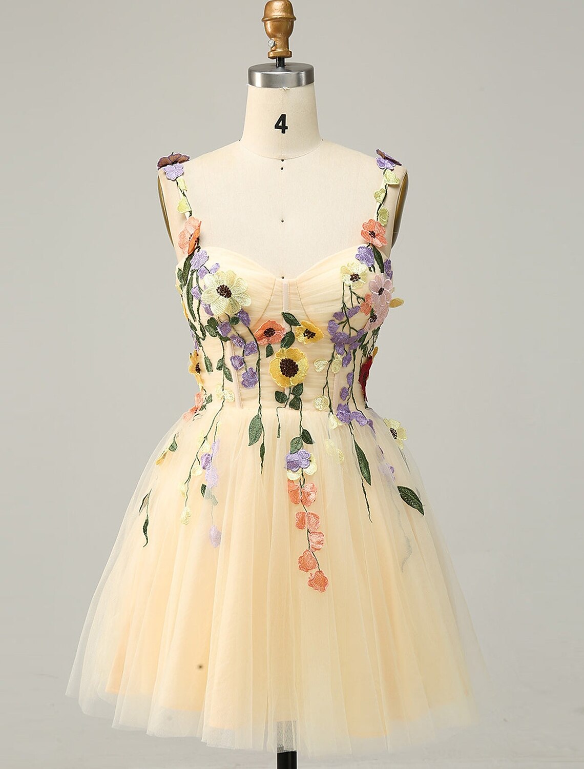 Elegant A-Line floral homecoming dress with spaghetti straps.