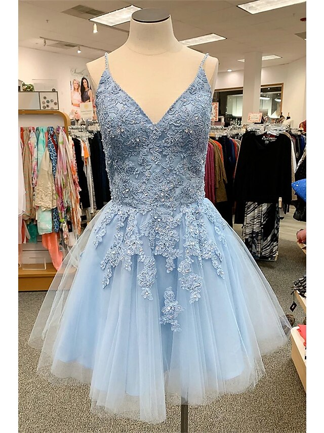 A-Line floral tulle homecoming dress with spaghetti straps and appliques.