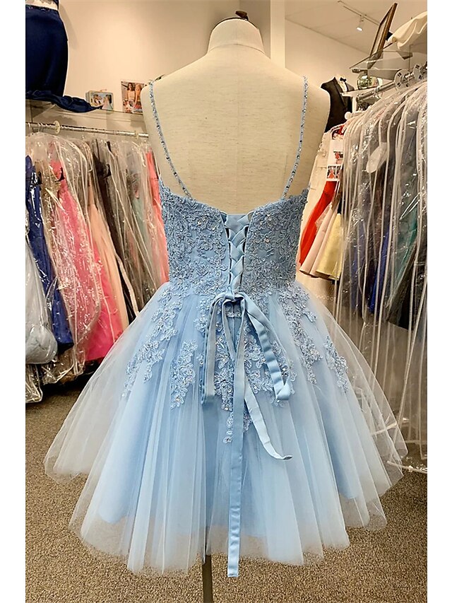 Back view of a short mini A-Line dress with floral appliques.