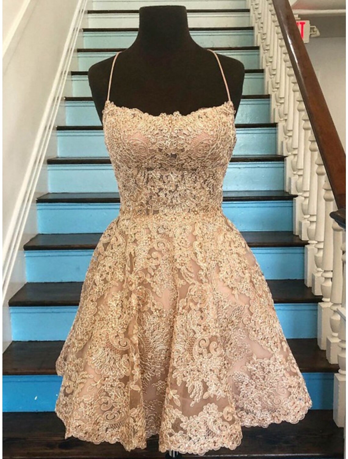 Front view of A-line short homecoming dress with floral lace and spaghetti straps.