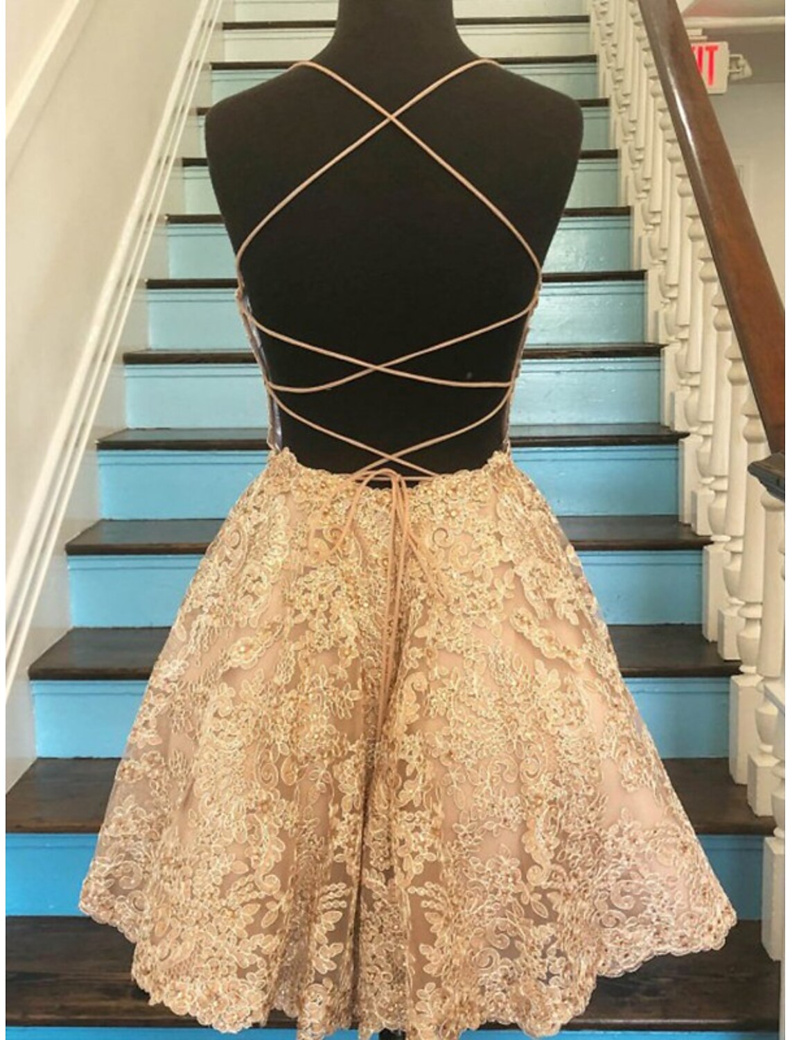 Back view of A-line short mini dress with delicate lace appliques.