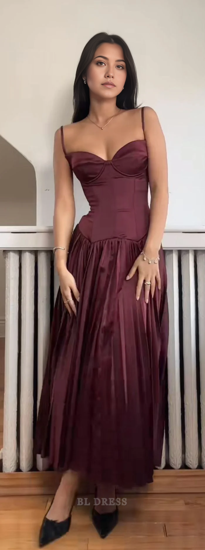 Elegant burgundy A-line dress with spaghetti straps and V-neck.