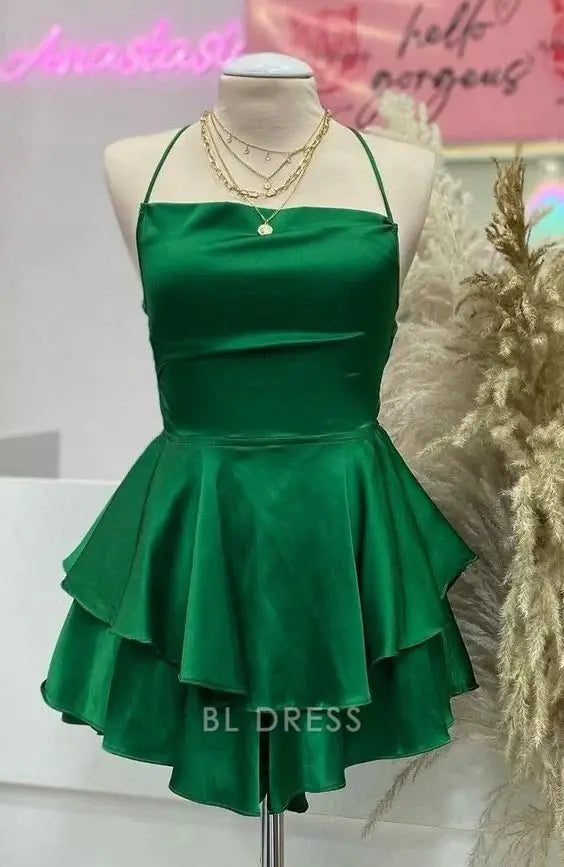Elegant green satin A-line short dress with spaghetti straps.