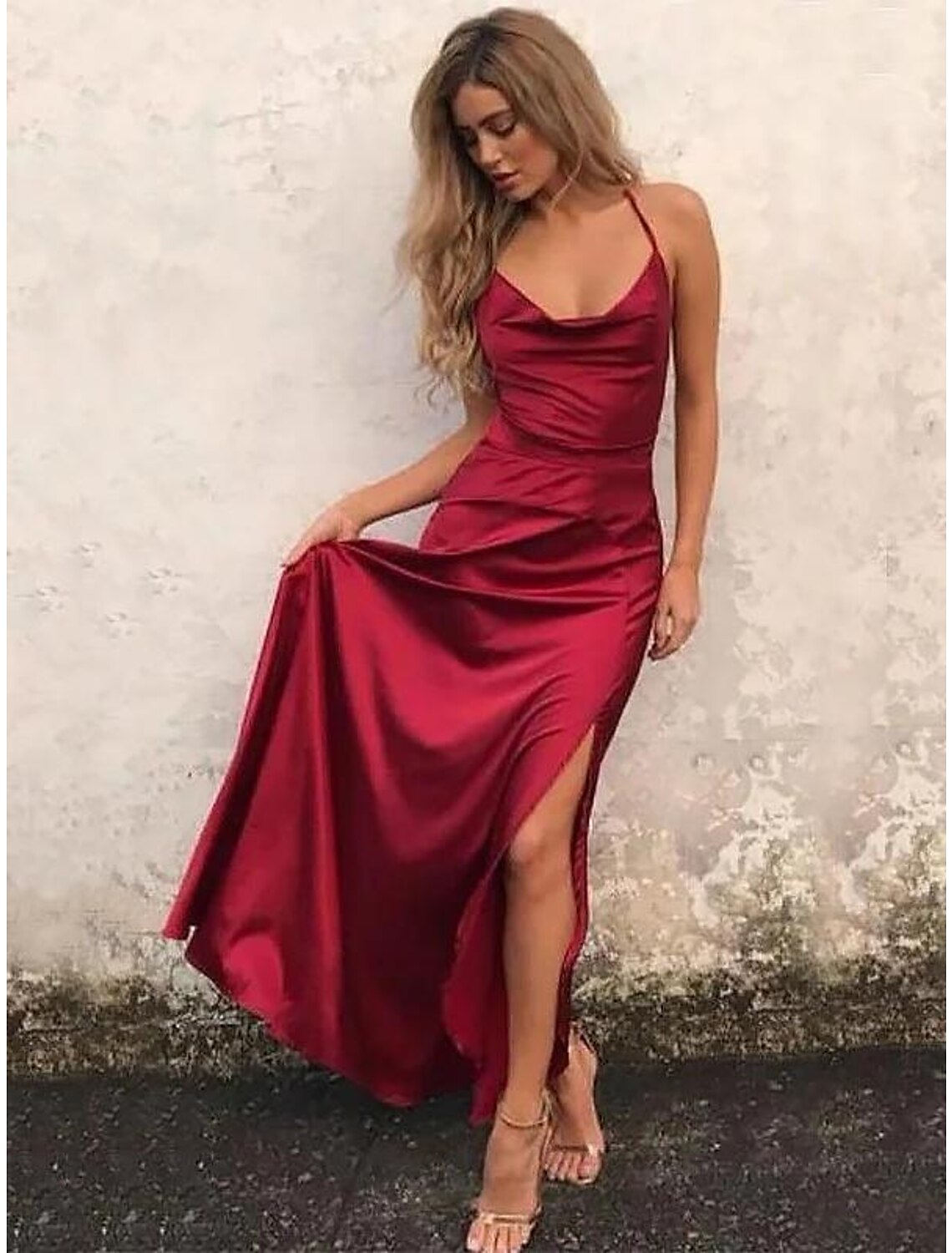 Elegant A-line satin evening dress with spaghetti straps and high slit.