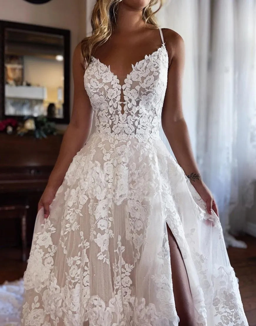 Side view of the A-line lace wedding dress, showcasing the thigh-high slit and elegant silhouette.