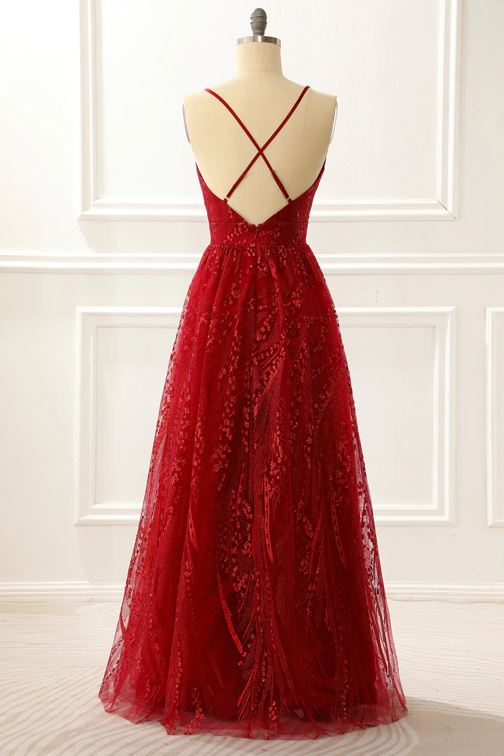 Side view of a model in the elegant burgundy A-line spaghetti strap prom dress.