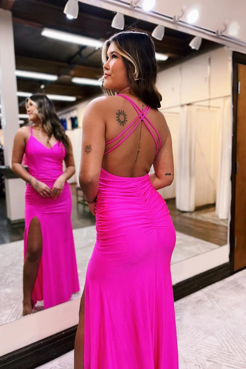 Back view of an A-line satin prom dress with cross-back spaghetti straps and a sweep train.
