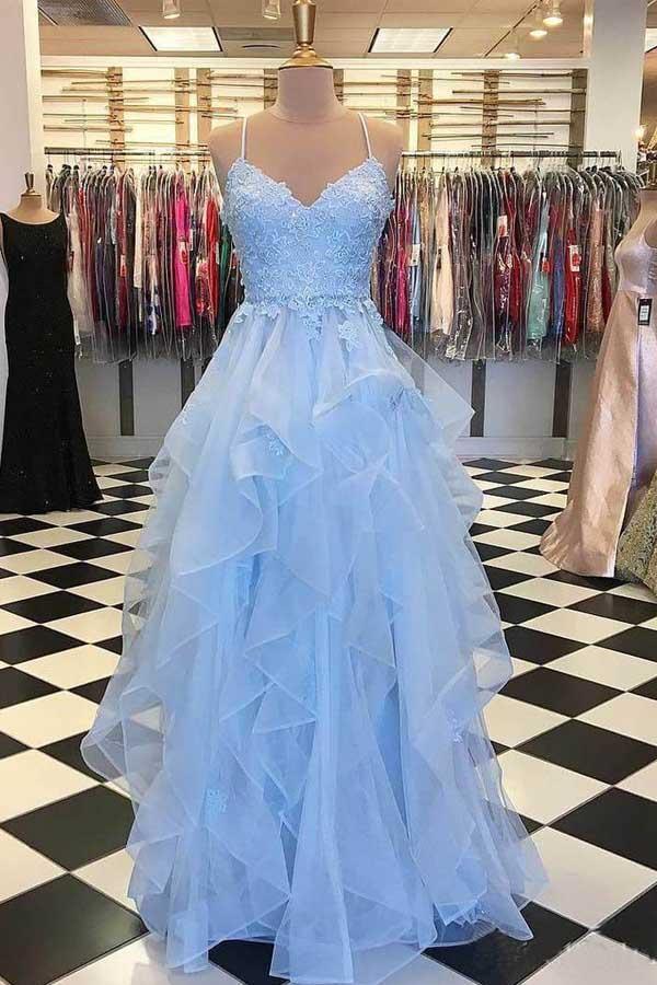 Elegant spaghetti strap ruffle prom dress on a model.