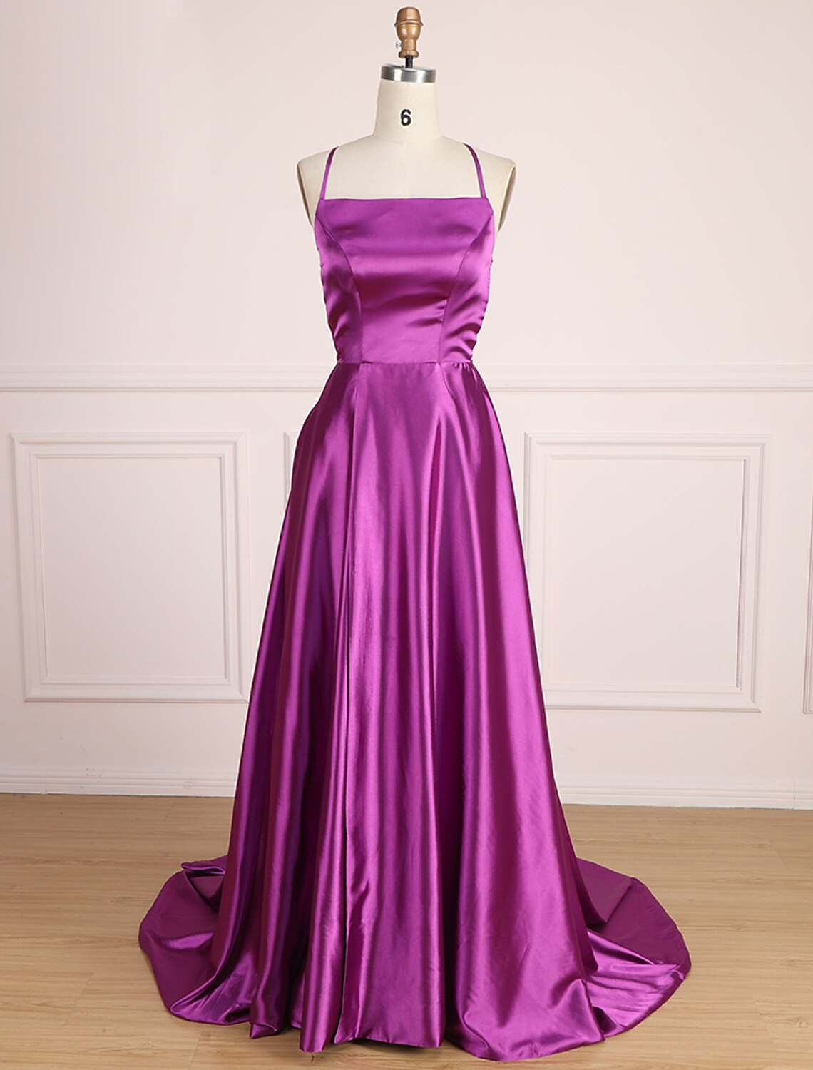 Detail of the satin fabric and pleats on the A-Line prom dress.
