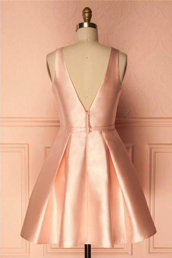 Back view of a simple short satin homecoming dress.