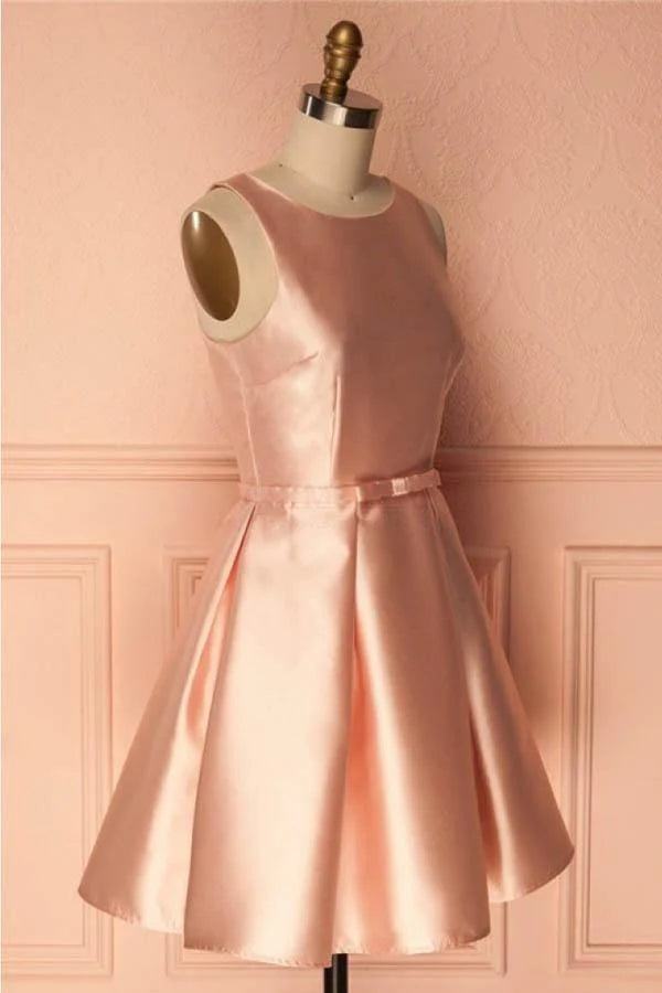 Close-up of the satin fabric and spaghetti strap detail on a short dress.