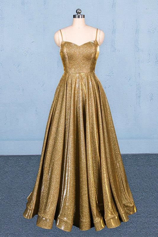 Woman wearing a dark blue spaghetti strap A-line formal floor-length dress.