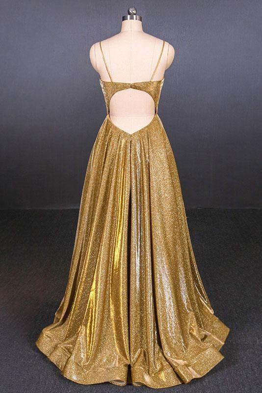 Back view of a woman in a dark blue spaghetti strap A-line formal floor-length gown.