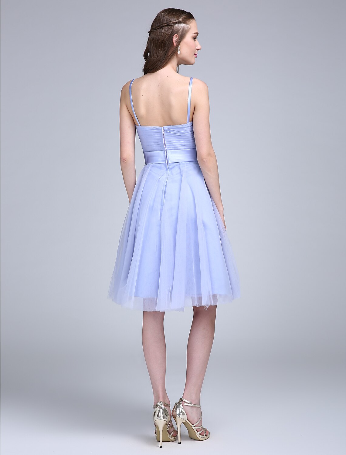 Back view of A-line tulle bridesmaid dress with criss-cross straps.