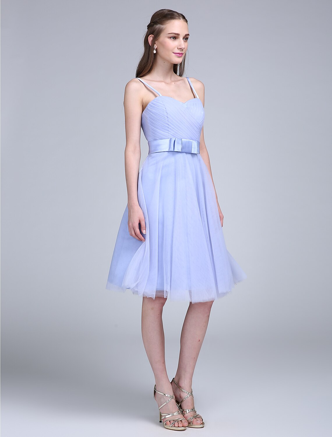 Detail of spaghetti straps and neckline on bridesmaid dress.