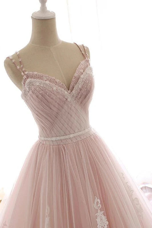 Close-up of the bodice and lace appliques on the spaghetti strap A-line prom dress.