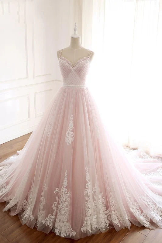 Full length view of the A-line spaghetti strap prom dress, highlighting its flowing tulle skirt.