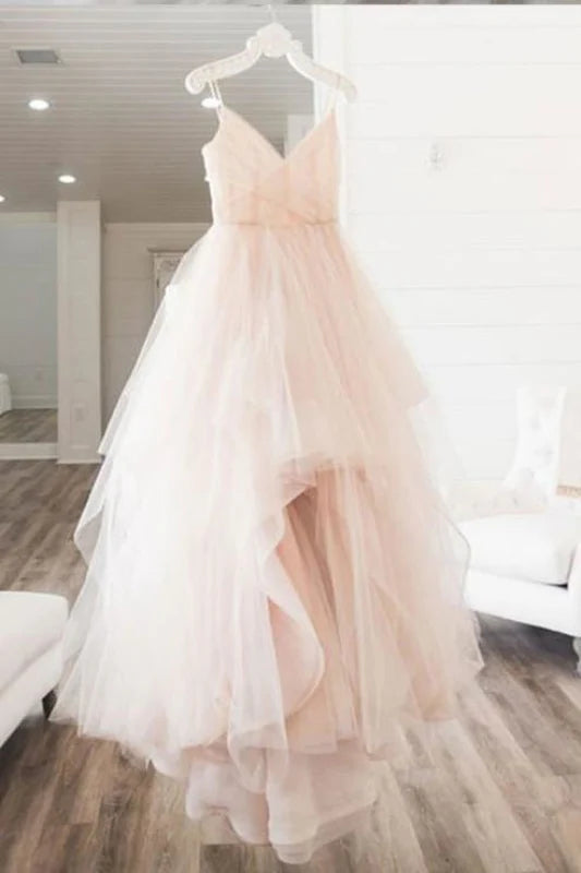 Elegant A-line tulle wedding and prom dress with spaghetti straps.