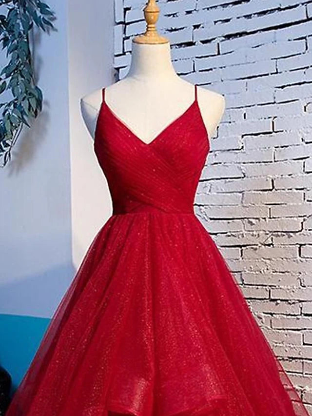 Model showcasing the floor-length A-line party dress with delicate spaghetti straps.