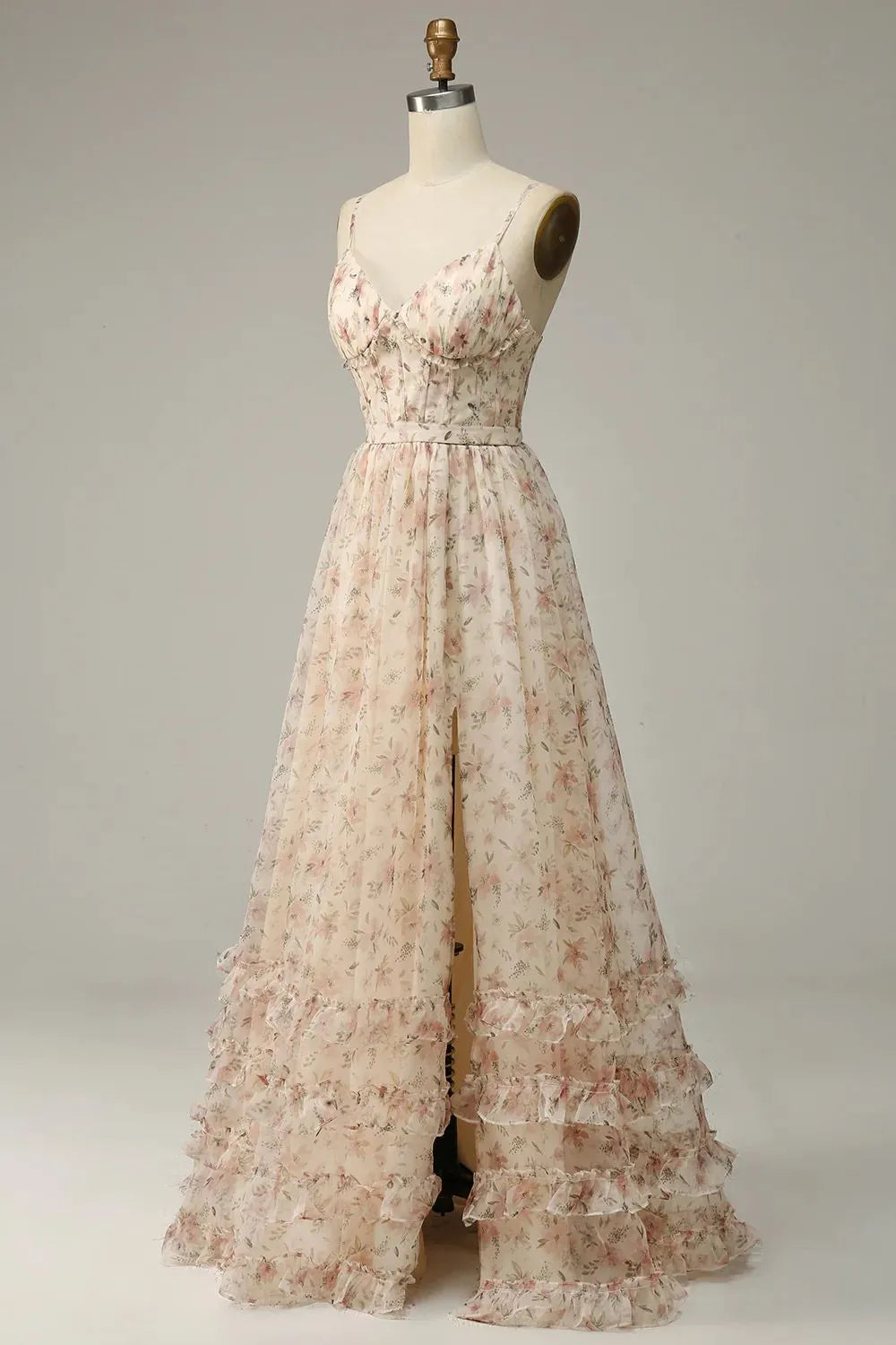 Close-up of the printed fabric and V-neckline of the apricot prom dress.