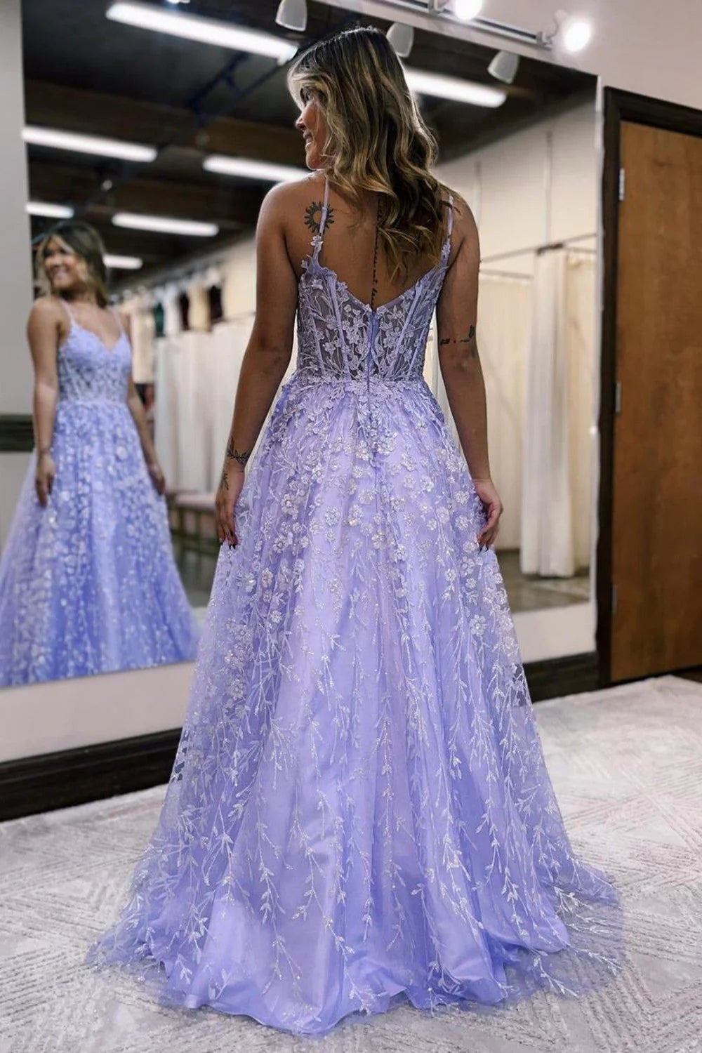 Back view of lilac A-Line prom dress with delicate appliques.