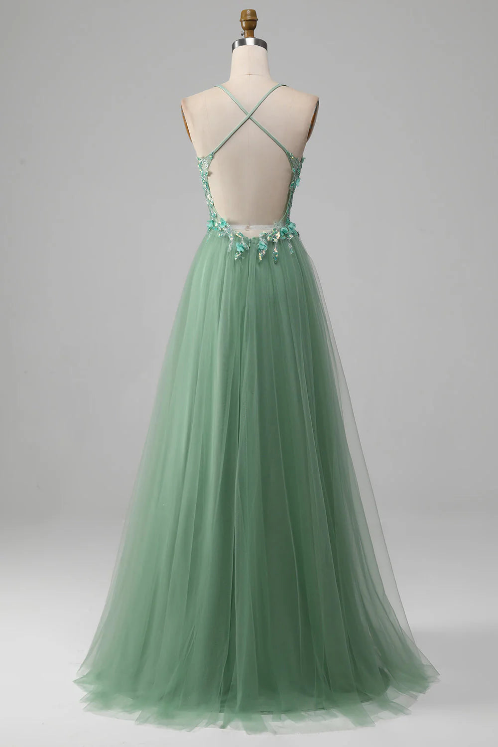 Back view of a green A-line prom dress with corset lacing.